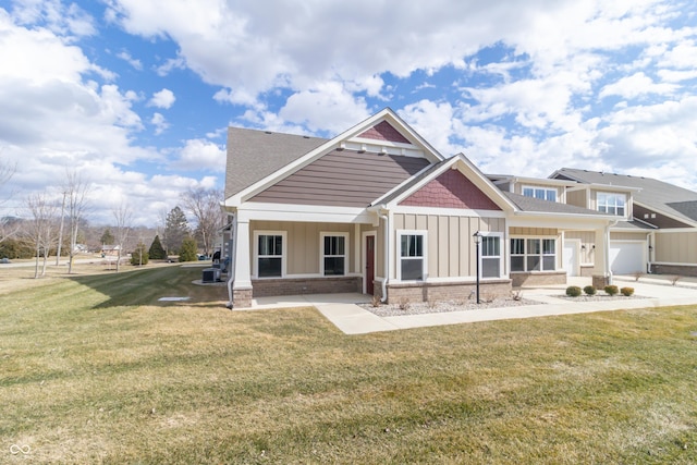 exterior space with brick siding, central air condition unit, covered porch, board and batten siding, and a front yard