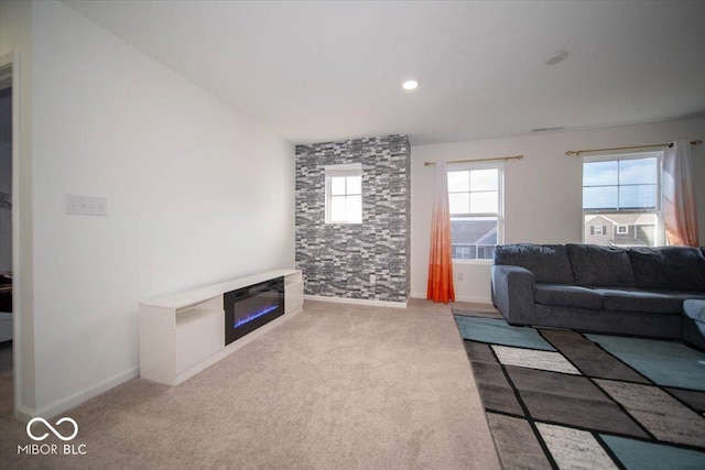 10202 Meadow Path Ln, Indianapolis, IN 46239 - carpeted living room with a glass covered fireplace, baseboards, and recessed lighting