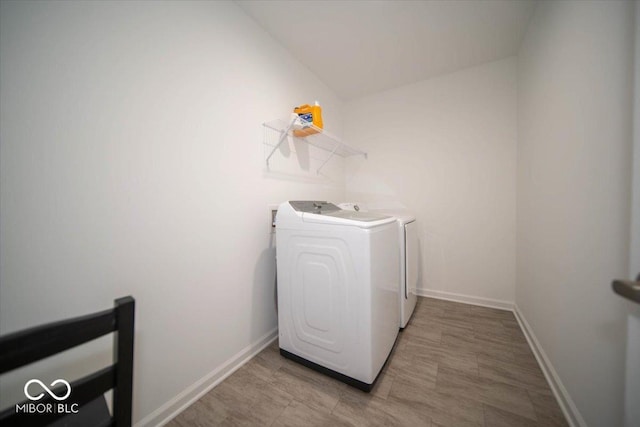 10202 Meadow Path Ln, Indianapolis, IN 46239 - washroom featuring separate washer and dryer and baseboards