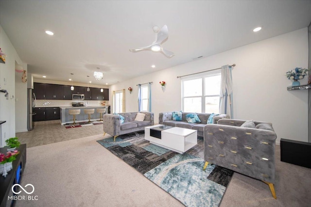 10202 Meadow Path Ln, Indianapolis, IN 46239 - living room featuring recessed lighting, light colored carpet, and ceiling fan