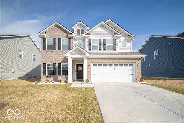 view of front of home featuring an attached garage, concrete driveway, and a front yard