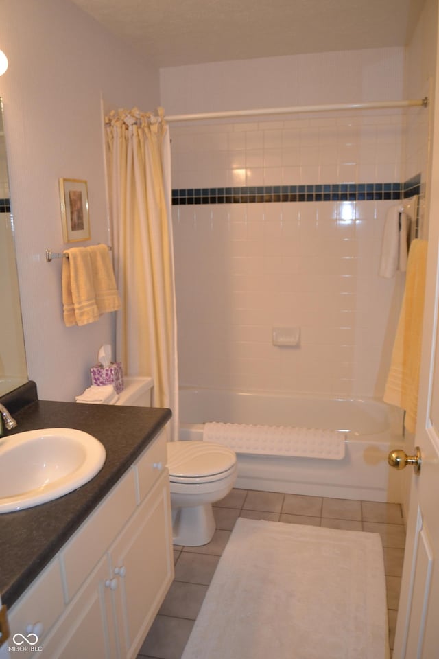 full bath with toilet, vanity, shower / bath combo with shower curtain, and tile patterned floors