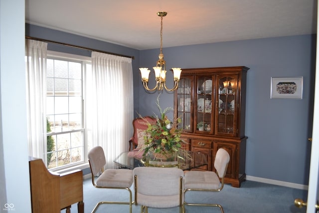 carpeted dining room with baseboards and an inviting chandelier