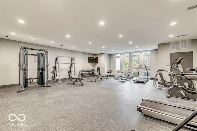 gym featuring visible vents, recessed lighting, and baseboards