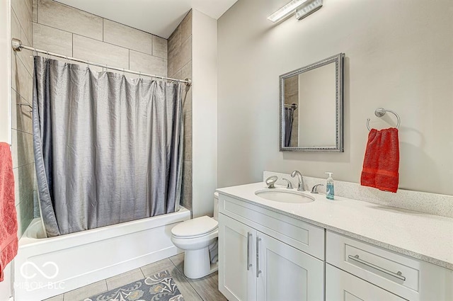 bathroom featuring shower / bathtub combination with curtain, toilet, and vanity