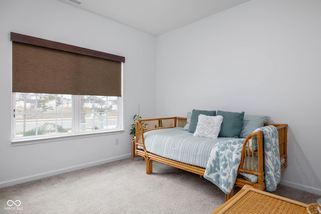 bedroom with carpet and baseboards