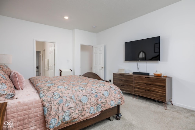 bedroom featuring light carpet, recessed lighting, connected bathroom, and baseboards