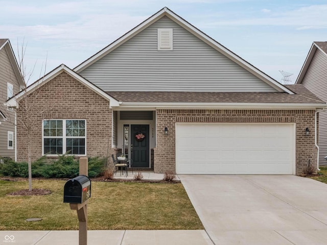 view of front facade featuring a garage, concrete driveway, roof with shingles, a front lawn, and brick siding