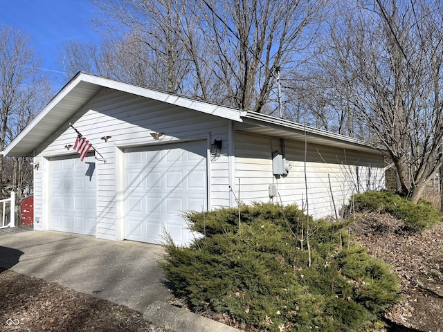 view of side of property with a garage and an outdoor structure