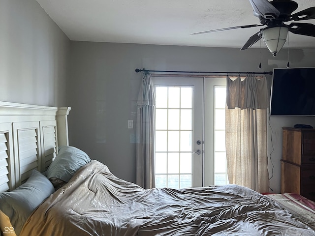 bedroom with ceiling fan and french doors