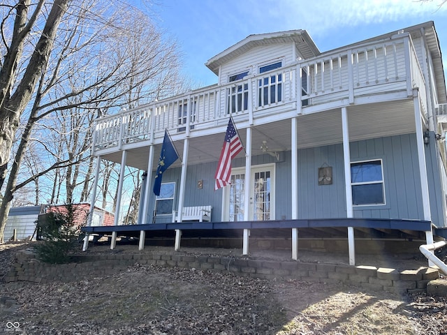 view of front of property with french doors and covered porch