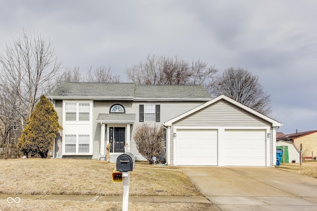 view of front of property featuring concrete driveway and an attached garage