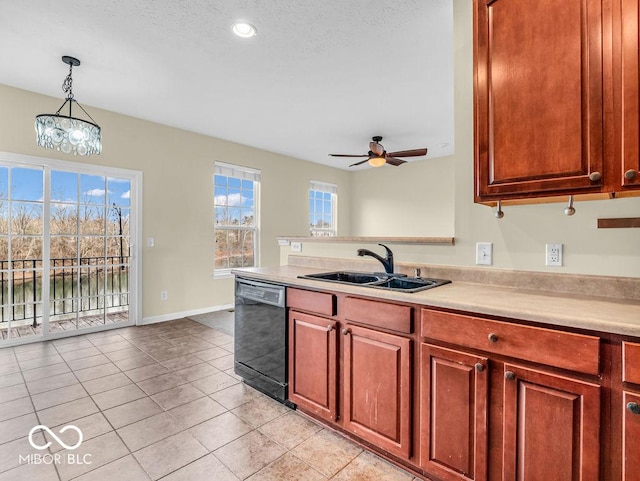 kitchen featuring light tile patterned floors, a sink, light countertops, dishwasher, and pendant lighting