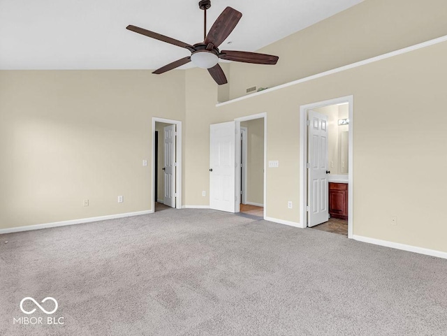 unfurnished bedroom with high vaulted ceiling, carpet, visible vents, and baseboards