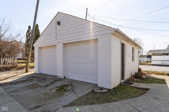 detached garage with fence