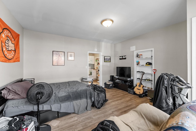 bedroom featuring wood finished floors