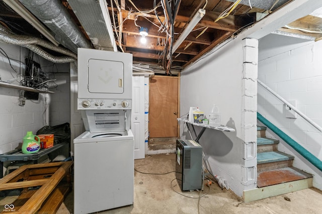 washroom featuring laundry area and stacked washing maching and dryer