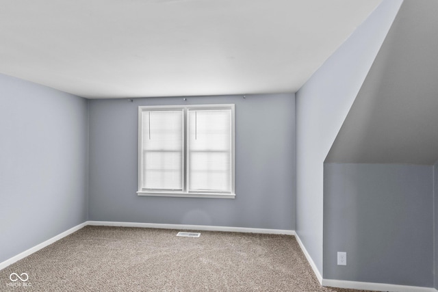 bonus room featuring carpet floors, baseboards, and visible vents