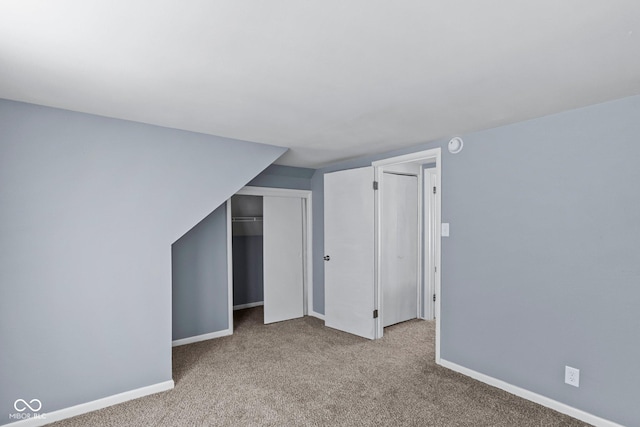 additional living space with carpet flooring and baseboards