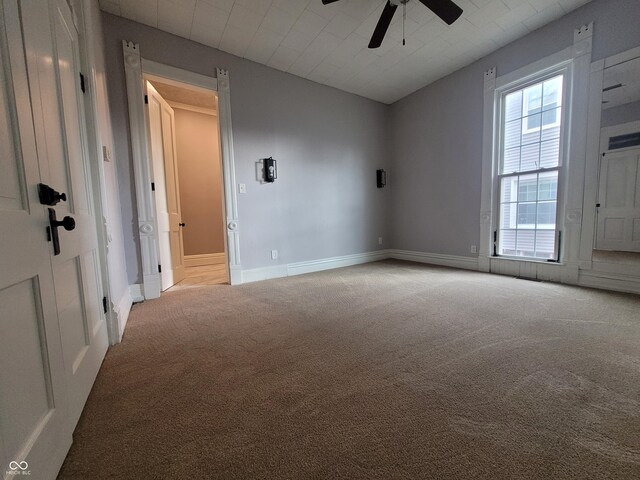 608 E Main St, Crawfordsville, IN 47933 - unfurnished room with lofted ceiling, ceiling fan, baseboards, and light colored carpet