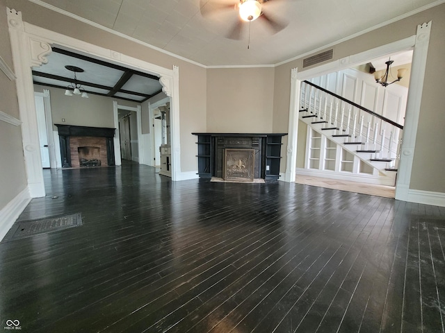 unfurnished living room with a fireplace, wood finished floors, visible vents, ornamental molding, and stairway