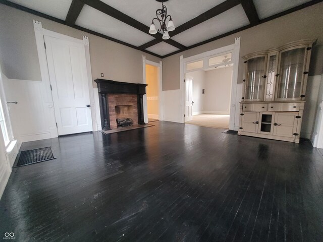 608 E Main St, Crawfordsville, IN 47933 - unfurnished living room featuring a fireplace with flush hearth, coffered ceiling, wood finished floors, and beamed ceiling