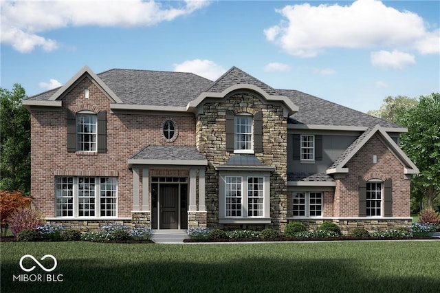 view of front of home with stone siding, roof with shingles, a front yard, and brick siding