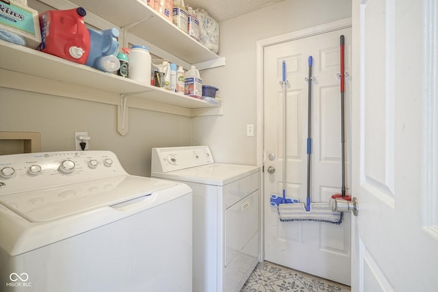 clothes washing area with laundry area and separate washer and dryer