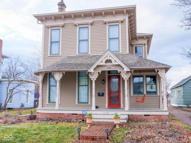 italianate home with crawl space, a chimney, and roof with shingles