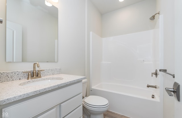 full bath featuring vanity, toilet, and tub / shower combination