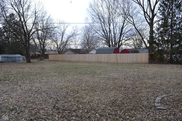 view of yard featuring fence