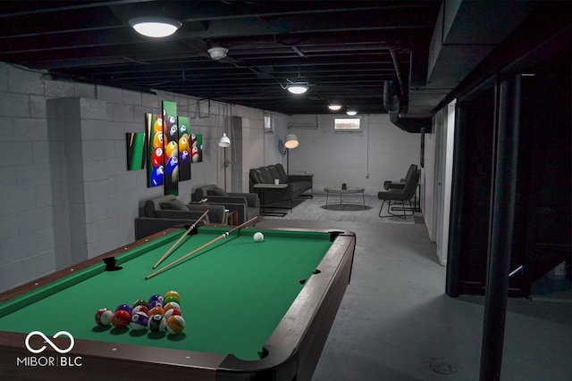 game room with pool table and concrete floors