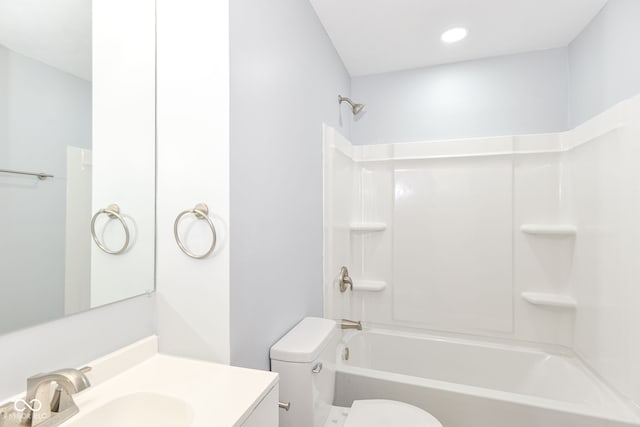 bathroom featuring shower / washtub combination, vanity, and toilet