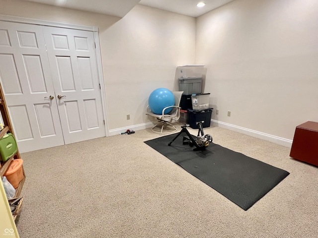 exercise room with carpet floors, recessed lighting, and baseboards