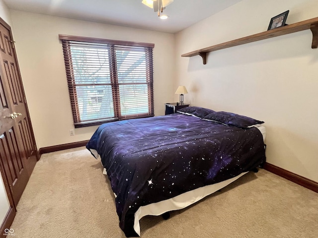 carpeted bedroom with baseboards