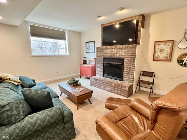 carpeted living room featuring a fireplace and baseboards