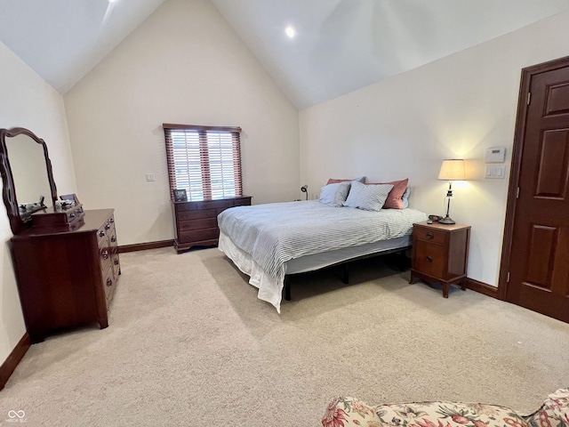 bedroom featuring high vaulted ceiling, baseboards, and light colored carpet