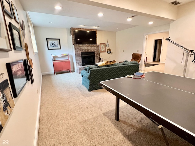 playroom featuring recessed lighting, light carpet, a fireplace, visible vents, and baseboards