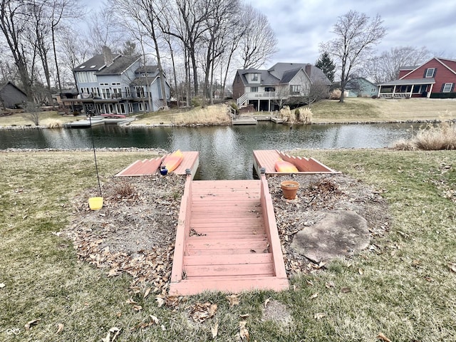 dock area featuring a water view and a residential view