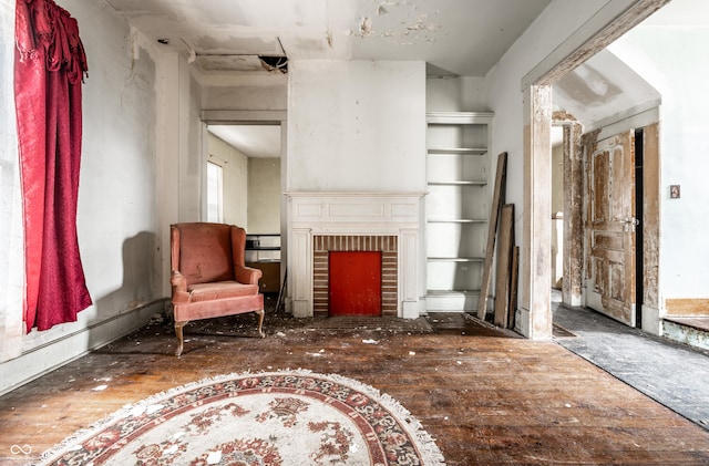 sitting room with a brick fireplace