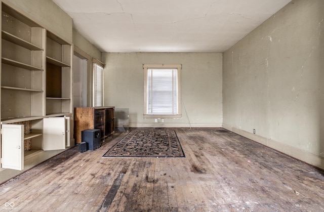 unfurnished living room featuring hardwood / wood-style floors