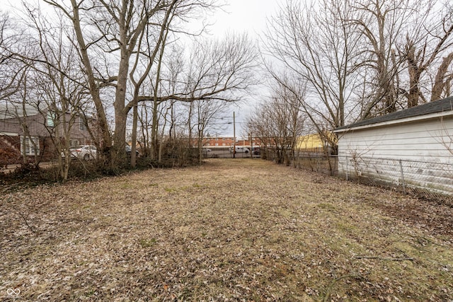 view of yard featuring fence