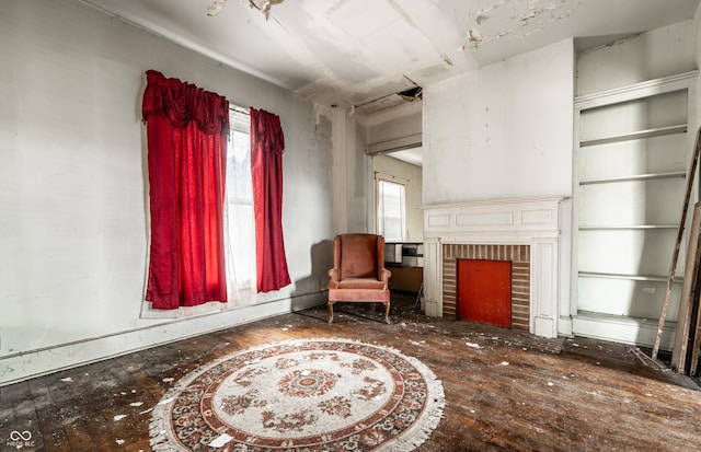 sitting room featuring a fireplace and a wealth of natural light