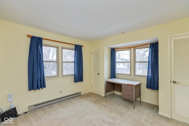 unfurnished bedroom featuring a baseboard radiator, baseboards, and light colored carpet