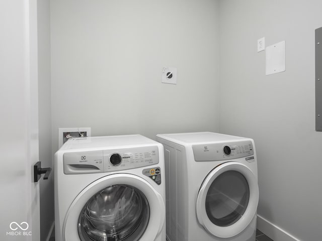 laundry area featuring laundry area and washing machine and clothes dryer