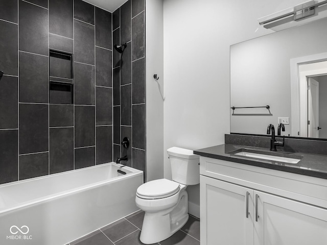 bathroom featuring toilet, vanity, shower / washtub combination, and tile patterned floors