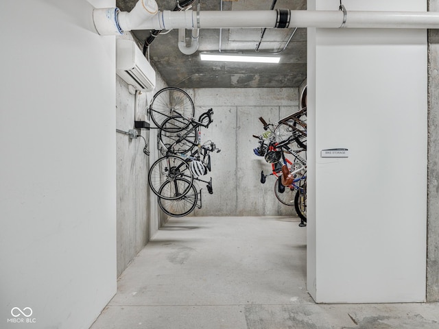 garage featuring bike storage and a wall unit AC