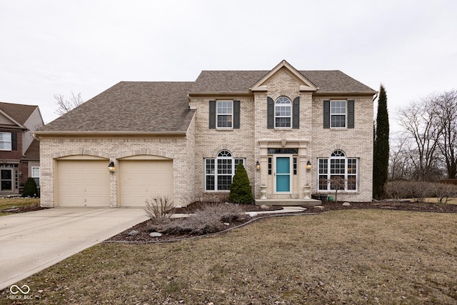 view of front of house with an attached garage, concrete driveway, and brick siding