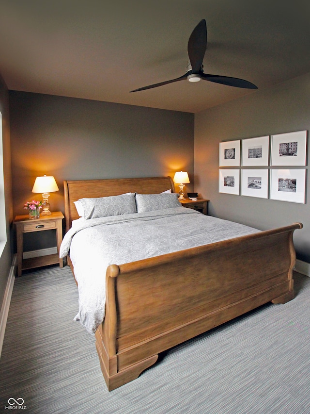 bedroom featuring carpet floors, baseboards, and a ceiling fan