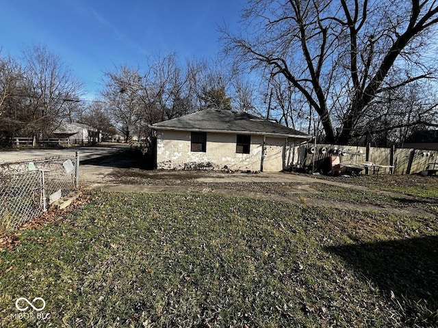 view of home's exterior with fence